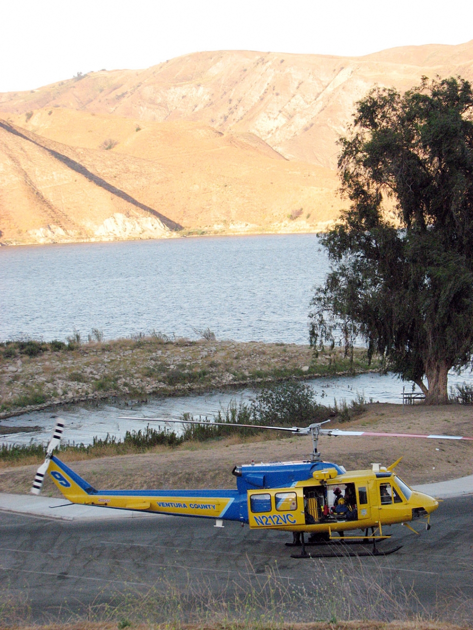 Photo of sheriff rescue copter on scene at drowning. Photo was taken last night while the copter rescue diver was underwater for 40 minutes searching. The search continues with huge family and Jewish Temple groups helping.