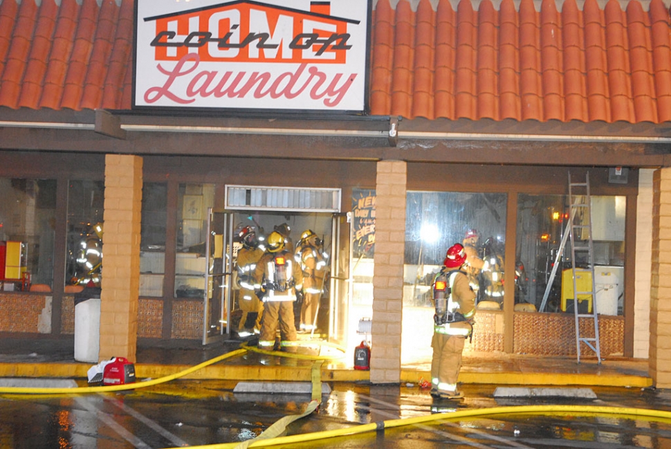 On 5-2-09 at approximately 7:15PM the City of Fillmore Fire Department responded to a report of a structure fire at the Laundromat located near Super A Foods at 751 Ventura Street. Upon arriving on scene firefighters observed heavy some from the front entrance and rooftop of the strip mall. The fire was knocked down within 30 minutes of the arrival of the first unit. Additional resources from the City of Santa Paula and County of Ventura were requested at shortly after the time of dispatch. Subsequent evaluation of the fire scene revealed heavy smoke and fire damage throughout the attic space of the structure however minimal damage was present at the ground level. Additionally, damage to adjacent structures was minimized to one ventilation hole being cut into the rooftop of the adjacent nail salon. The damage to the structure is estimated to be between $50,000 & $75,000, however the majority of the contents was unharmed. The cause of the fire remains under investigation. Courtesy of The Fillmore Fire Department.