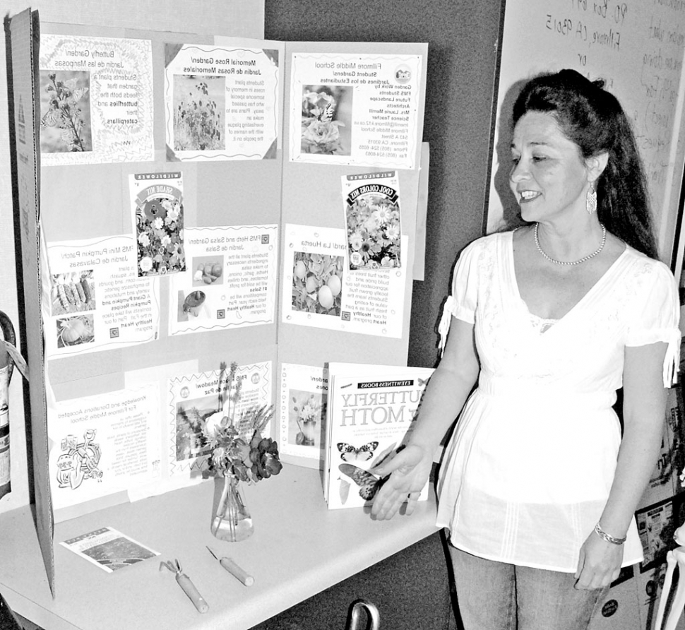 Teacher Laurie Merrill displays her classes Memorial Garden Board.