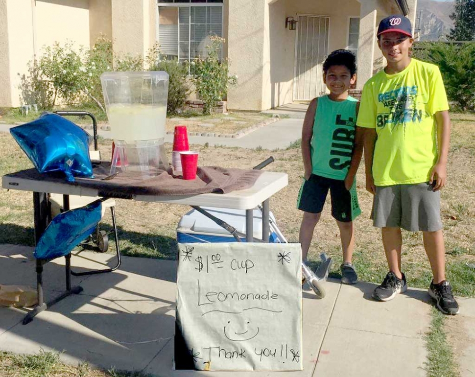 There is nothing better than some fresh lemonade on a hot summer day. Two friends (l-r) AC, 10, and Albert, 11 opened a lemonade stand this week at the corner of River and Central. Just doing their part to help people stay cool during this summer heat wave.