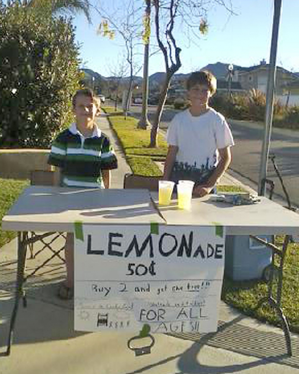 (l-r) Carston, 9, and brother Nolan, 13, opened business Sunday at the corner of B & River Streets. Lemonade was selling fast for the young entrepreneurs!