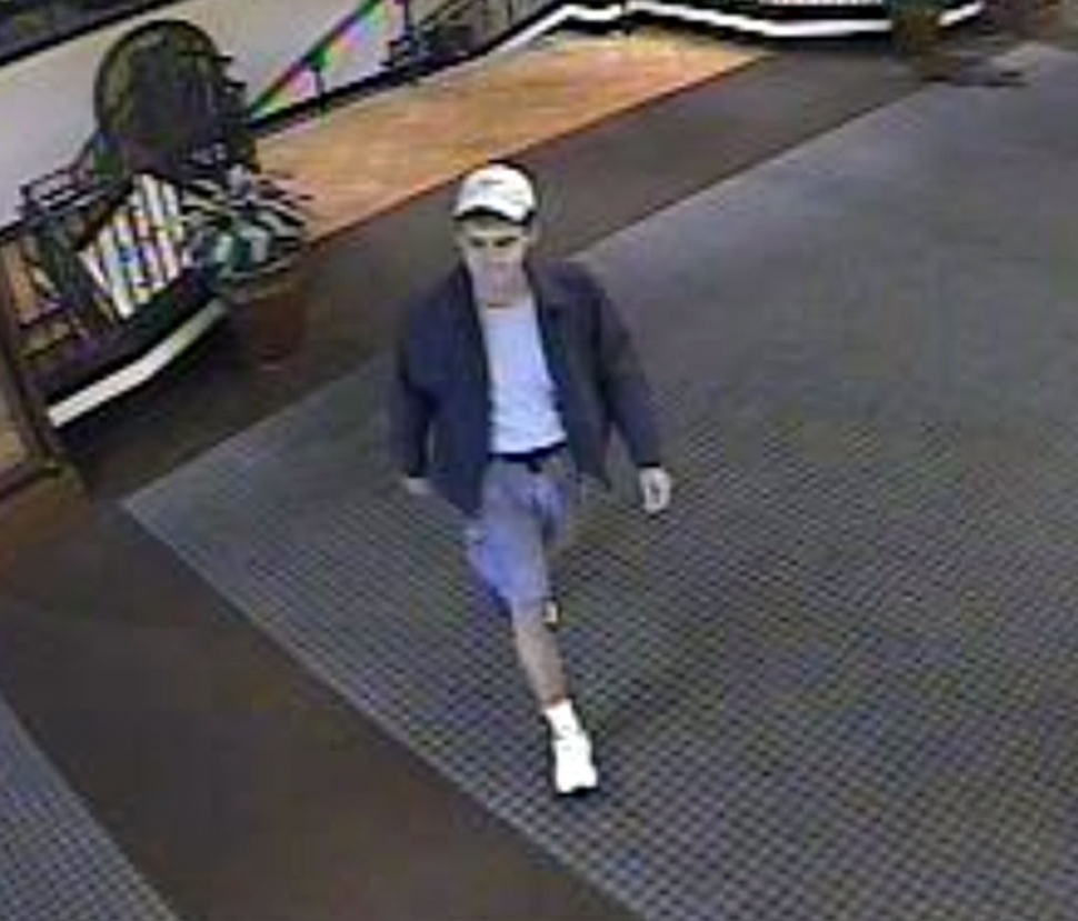 Suspect: White male, 25-30 years old, brown, wavy, curly hair, with facial stubble and a dirty appearance. On both occasions, the subject was seen on video wearing shorts, jacket, and a hat.