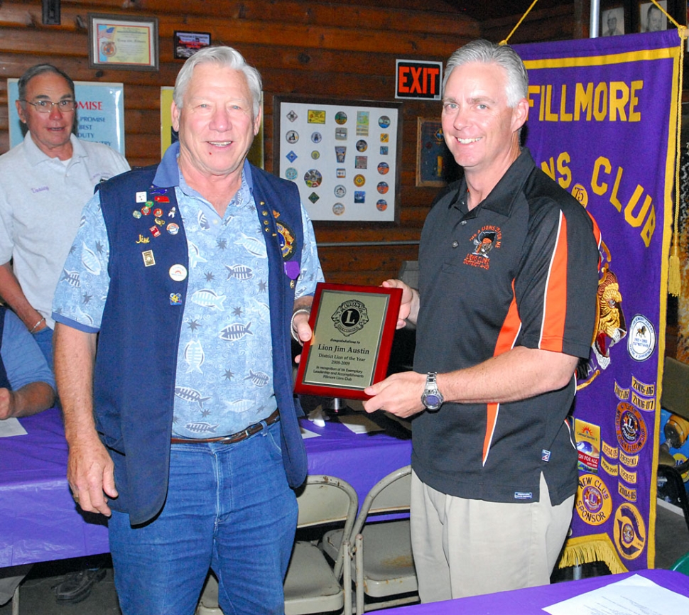 Lions Club member Jim Austin, left, receives the Lion of the Year Award (District 4A-3) from Lions Governor Dan Lyon, Monday night. The District covers Ventura, Santa Barbara, and San Luis Obispo counties. Over 40 members attended the awards dinner.