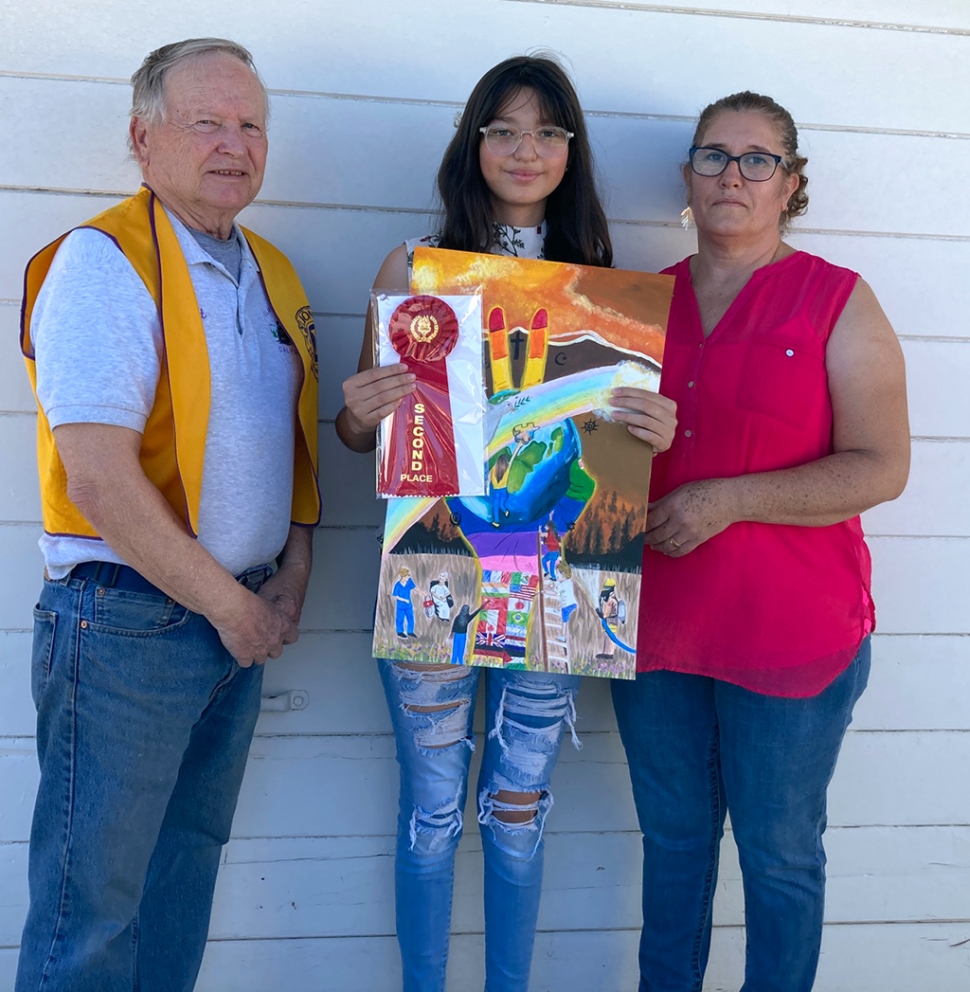 Lion’s Club member Scott Lee with Patricia Rivera and her mom. Particia won runner-up award for the Lions Club Peace Poster Contest.