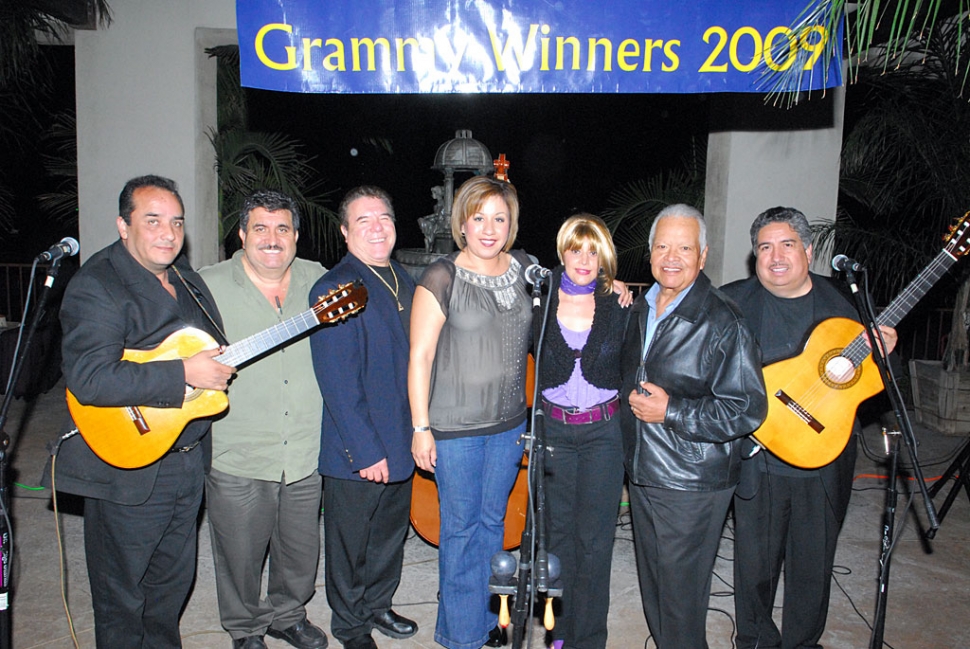 Mariachi Los Camperos celebrated its 2009 Grammy Award with a concert at El Pescador Restaurant, Saturday.
El Pescador owner, “Chuy” Ortiz, second from left, poses with the group Los Camperos de Nati Cano. Fillmore’s
own “Natividad “Nati” Cano, second from right, with wife Andrea. Names of other members present were not available at press time.