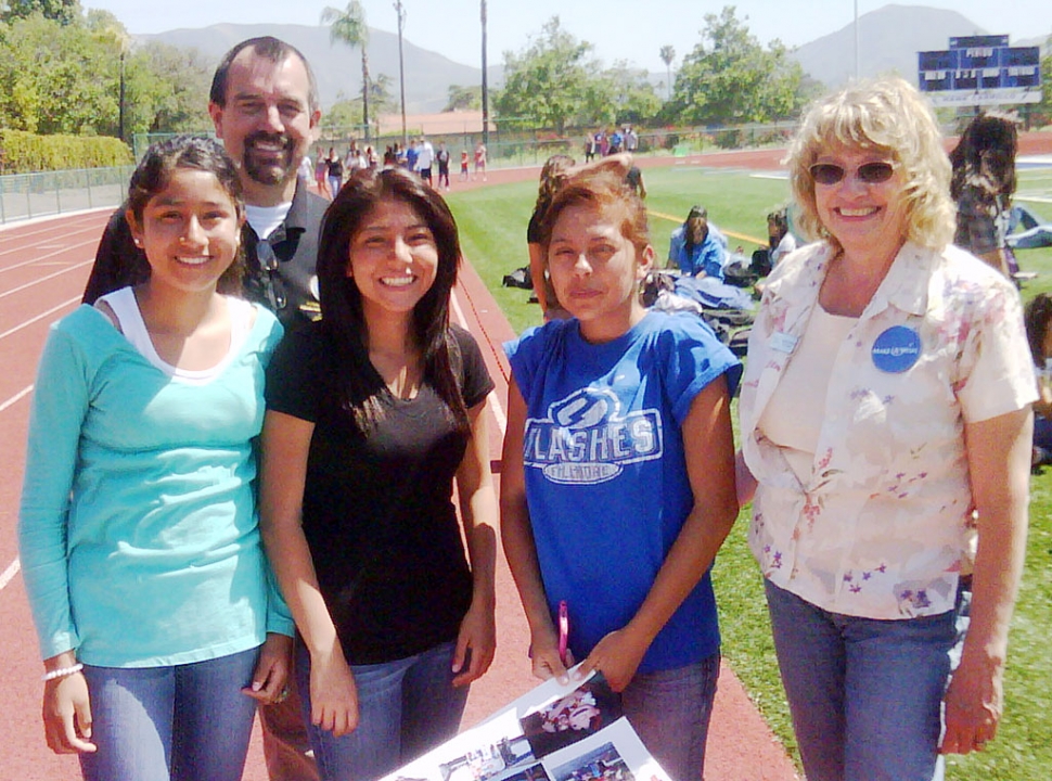 Shown above: Participating in the Make a Wish event were (l-r) Clarisa Martinez, John Wilber, Tania Morales, Aime Lopez, and a Make-A-Wish Representative.

Fillmore High School Associated Student Body hosted their Walk for Wishes on May 19th, at the football field, to help make wishes come true for kids with life threatening medical conditions. Walkers secured sponsors from friends, family and local businesses. 100% of the sponsorships went to Make-A-Wish Foundation of the Tri-Counties. It was a fun afternoon of exercise, great food, camaraderie and entertainment. The group had a goal of $5,000 to adopt the wish of a child. The goal was $5,000, however they reached approximately $3,000.  Make a Wish is working with several high schools in Ventura County-- Simi Valley HS, Channel Islands HS, Adolfo Camarillo HS, and Fillmore HS.  The goal was to keep it simple, and let the students organize their own fundraisers with the minimum goal of granting a single wish between all the schools.  It costs about $5,000 to grant a wish.  Everyone involved can be very proud that they were able to raise so much money.  With more planning, next year they hope to raise the full $5,000 needed to grant a wish.  The three students in Fillmore responsible for organizing the event were Veronica Ocegueda, Taelor Burhoe and Esperanza Ocegueda. Fillmore High School PE teachers Curtis Garner, Matt Suttle and Kari Appleford raised over $1,200 by encouraging their PE students to participate. Also a class at San Cayetano brought in over $300, and the Alverdi family brought in close to $300 in sponsors. It was a great day!