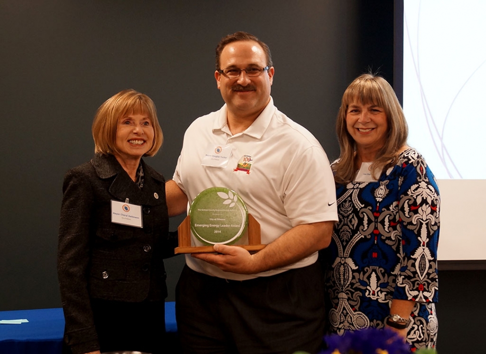 Cheryl Heitmann, VCREA Vice-Chair and City of Ventura Mayor presents the Emerging EnergyLeader Award to Douglas Tucker, Mayor of Fillmore, at the Ventura County Regional Energy Alliance (VCREA) 2nd Annual Energy Leadership Reception on January 29th. (l-r) Cheryl Heitmann, Douglas Tucker, and Sue Hughes, Deputy Executive Officer, VCREA. Photo by Gia Allen.