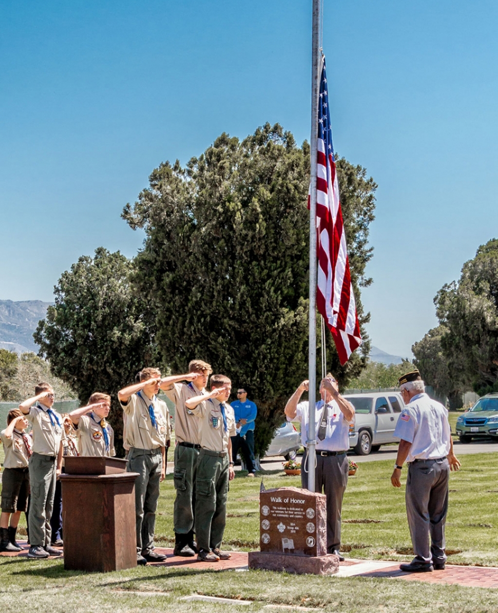 (above) A previous ceremony where Fillmore Boy Scout Troop 406 and Cub Scout Troop 3400 salute for the raising of colors. Photo by Bob Crum.