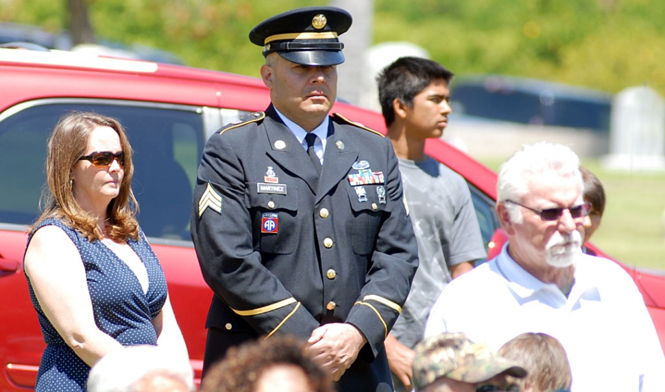 A soldier stands at-ease during the Veteran Memorial Service at Bardsdale Cemetery on Monday. Dick Diaz, shown right with sunglasses, delivered the Memorial Day message. Diaz served in the Marine Corps from 1966-1969 and was in Viet Nam in 1967/68. Opening remarks were made by Monty Winkler, President, Board of Trustees. There was a Presentation of Colors by Veterans of Foreign Wars, Fillmore Post 9637 and Pledge of Allegiance, Boy Scout Troop #406 and Cub Scout Troop #3400. Music was provided by Bill Bartels. The Placing of the Wreath was performed by William Brunet; Placing of the Bouquet by Marie Schilling, Gold Star Wives. Commander Jim Rogers read the names of those who died in the Service of our Country. Volly was performed by Honor Guard VFW; and Taps was provided by Bob Thompson.