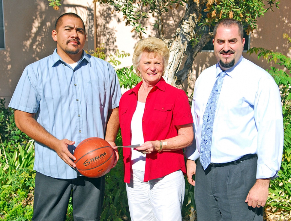 F.M.S. Basketball Coach Joey Alcantar, Piru Petroleum representative Linda Edmonds, and Principal Todd Schieferle.
