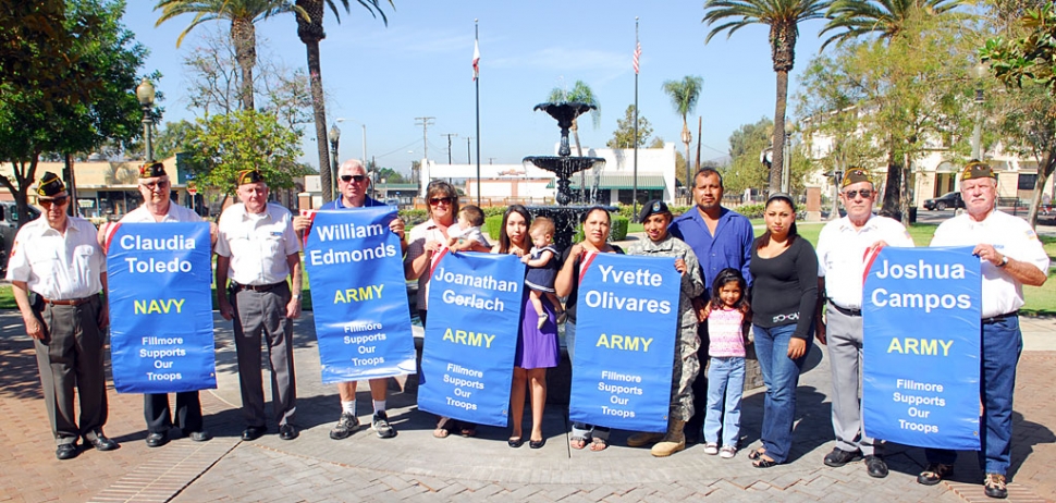 Above community members and parents come together for banners to be hung on Central Avenue, Wednesday Sept. 9th.