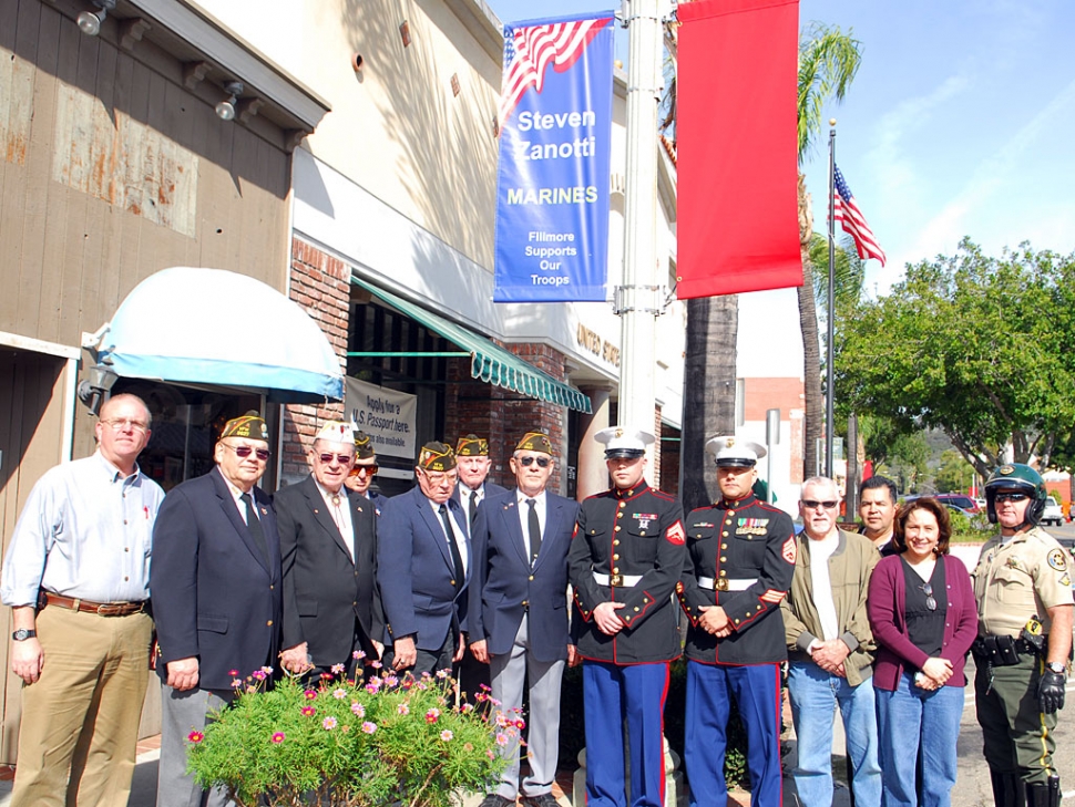 On February 20th, a group of concerned Fillmore citizens and those wishing to honor our nation’s military service personnel (pictured in no order) gathered to install military banners on the historic street lamp posts on Central Avenue. The five young men honored were; United States Army Sergeant Kevin “Buddy” Edwards, Specialist Michael Edwards, PFC George Poppic, United States Navy Petty Officer Second Class Phillip Diaz and United States Marine Corps Corporal Steven Zanotti. Deputy City Manager Bill Bartels coordinated the installation of the Banners by City Public Works employees; Joe Zuniga, David Brown and Arnold Casteneda, Zanotti and his parents, Tom and Cindy Zanotti, Staff Sergeant Jacob Avila, School Board Member Virginia de la Piedra, School Superintendent Jeff Sweeney and Fillmore Fire Chief Bill Herrera. Veterans of Foreign Wars Post 9637 Commander Jim Rogers, Past Commander and Treasurer Bill Brunet, Past Commander and Service Officer/Chaplain Al Rosette, Member Bobby Donald and Member Wendell Tilley honored the event with a crisp salute after the first banner was installed.