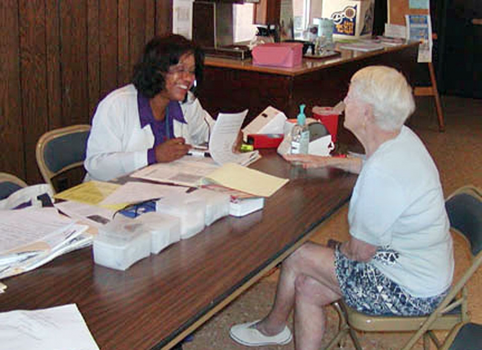 Community Health Nurse Angela Glover, with the VC Health Care Agency, visits the El Dorado Mobile Home Estates once a month to give free healthcare to local seniors. Here she assesses resident Dee Dicey. Included in her mobile services are blood pressure screenings, blood sugar, Health Risk Assessment, BMI Index, Hemo and Cholesterol levels, and bone density checks in the future. Glover is hoping to come into the Fillmore Senior Center soon. She named Braille, weight baring, balance classes, HICAP, Greylaw, Red Cross, and Medicare as just a few agencies and program that could be brought into the center.