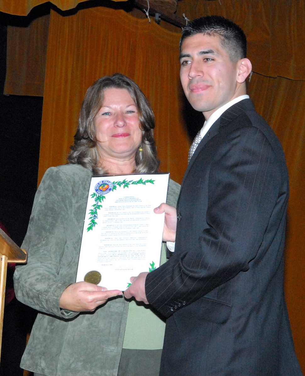 Police Officer of the Year Beau Rodriguez and Mayor Patti Walker.