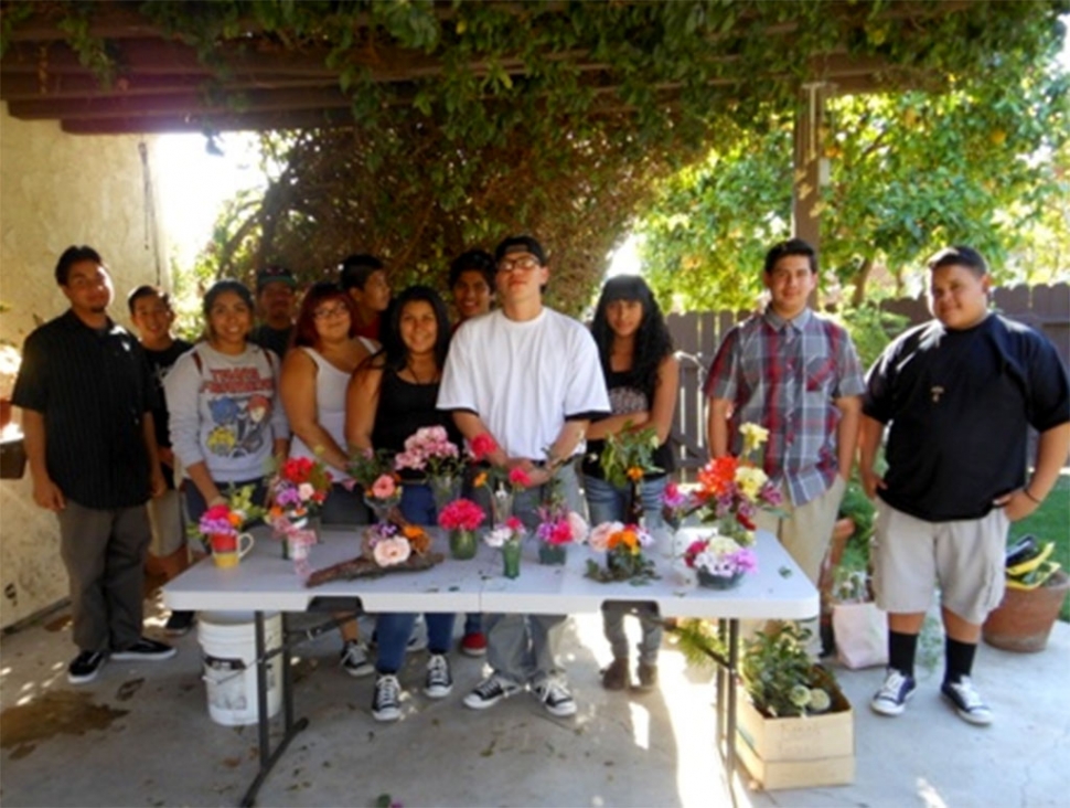 One Step A La Vez teens display their creations at a workshop led by Civic Pride committee members to engage Fillmore’s youth to enter the flower show and practice making an arrangement.