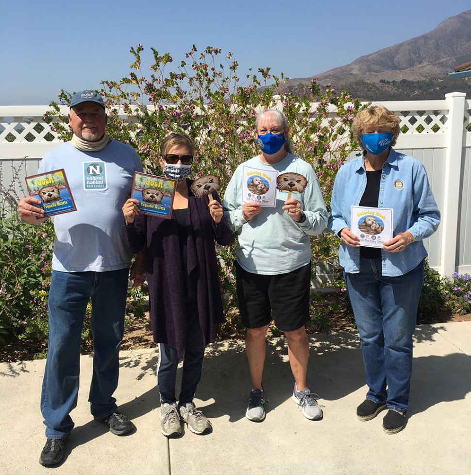 Rotarians (l-r) Dave Anderson, Ari Larson, Cindy Blatt, and Martha Richardson, holding up their Josh the Otter gift bags which will be delivered to Fillmore schools. Photo courtesy Rotary Club of Fillmore.