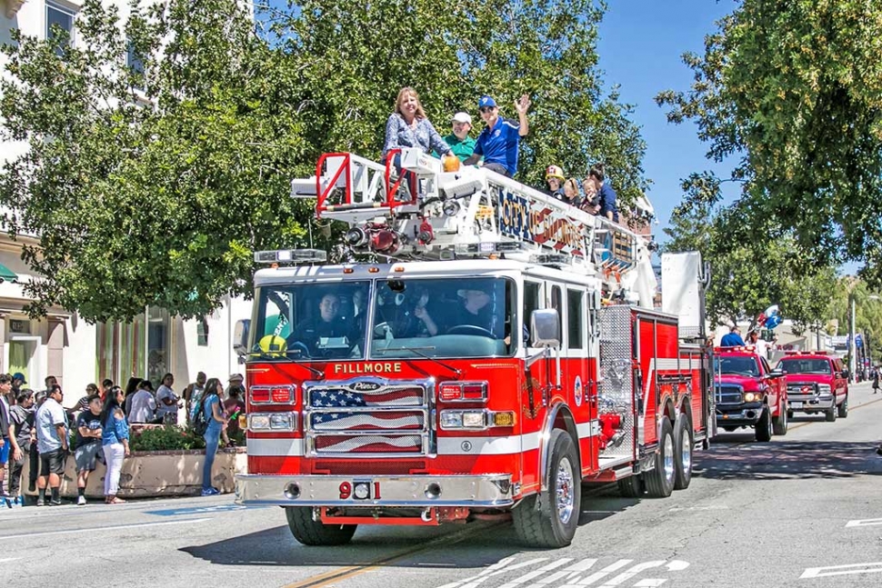 Photo of the Week by Bob Crum. Fillmore Fire Department Ladder truck with Fillmore City Council and community members. Photo data: ISO 100, 16-300mm lens @32mm, f/10 @1/160 sec. 