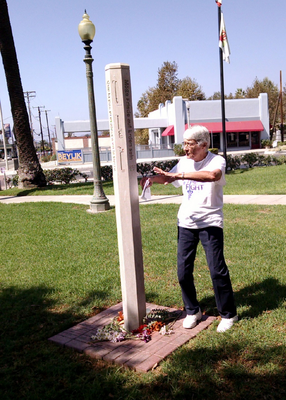 A group gathered around the Fillmore Peace Pole in Fillmore City Park on September 21 to remind us all of the need for peace in our families, our community, our nation and the world.  The Peace Pole was installed in 2009 by the Fillmore Sorptimist Club under the leadership of Sarah Hansen.  It has engraved into the pole 
