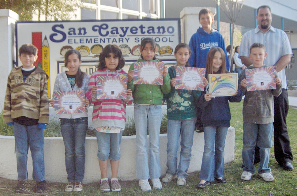 San Cayetano students show off their Personal Success Award certificates.