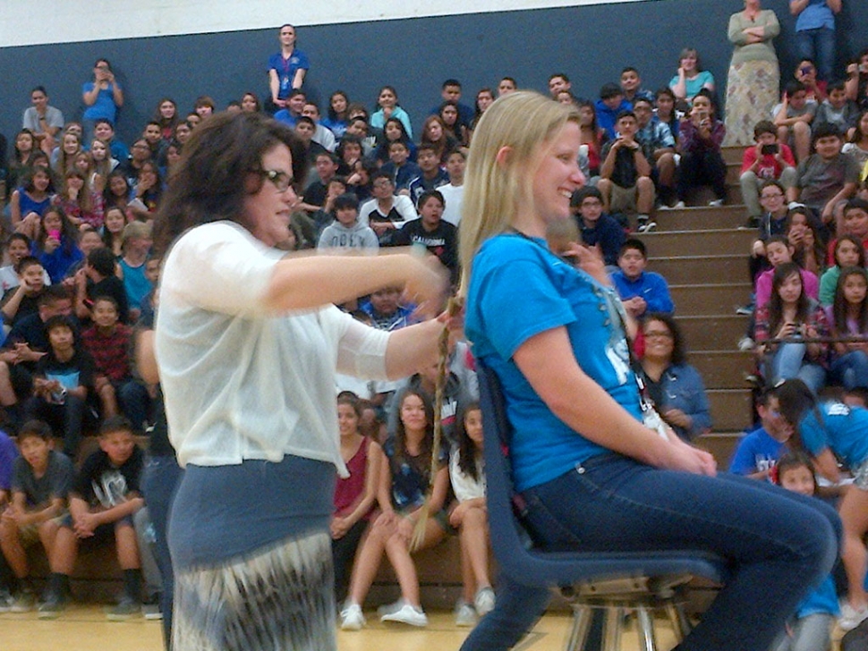 Fillmore Middle School held their spring rally on Friday, March 14th. The Associated Student Body (ASB) planned and led the rally which included two teachers, Mrs. Nichols and Ms. Dyer, cutting their hair to donate for cancer victims. In February FMS students raised over $2,000 in the Pennies for Patients Fundraiser. The charity raises money to support the families of cancer victims as well as cancer research. After a brief “dance off” to break the tie, the 8th grade class won the rally. Pictured above, Ms. Dyer as her hair is cut for charity.