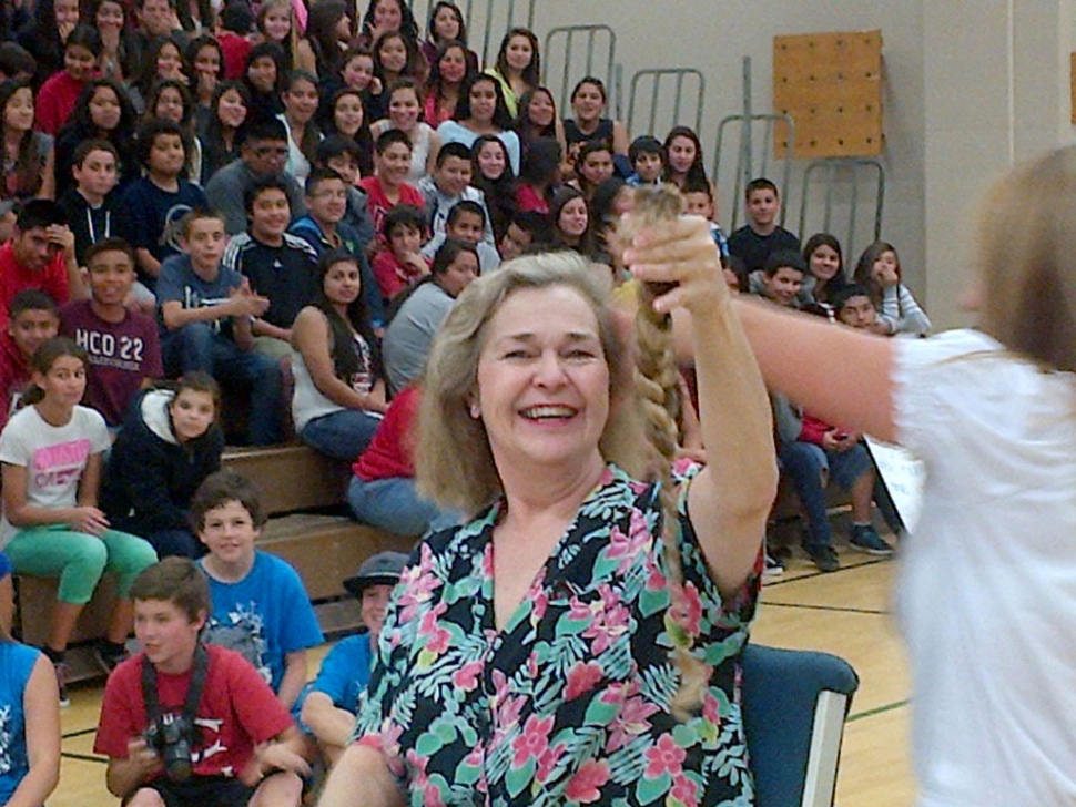 Mrs. Nichols shows off her donation for charity.