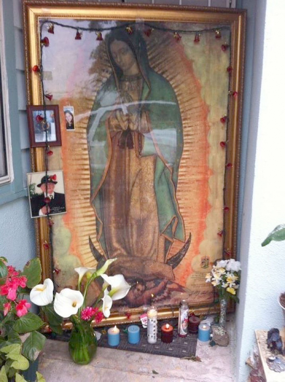 A memorial to Angela Perez who died of stab wounds Friday is displayed on her front porch.