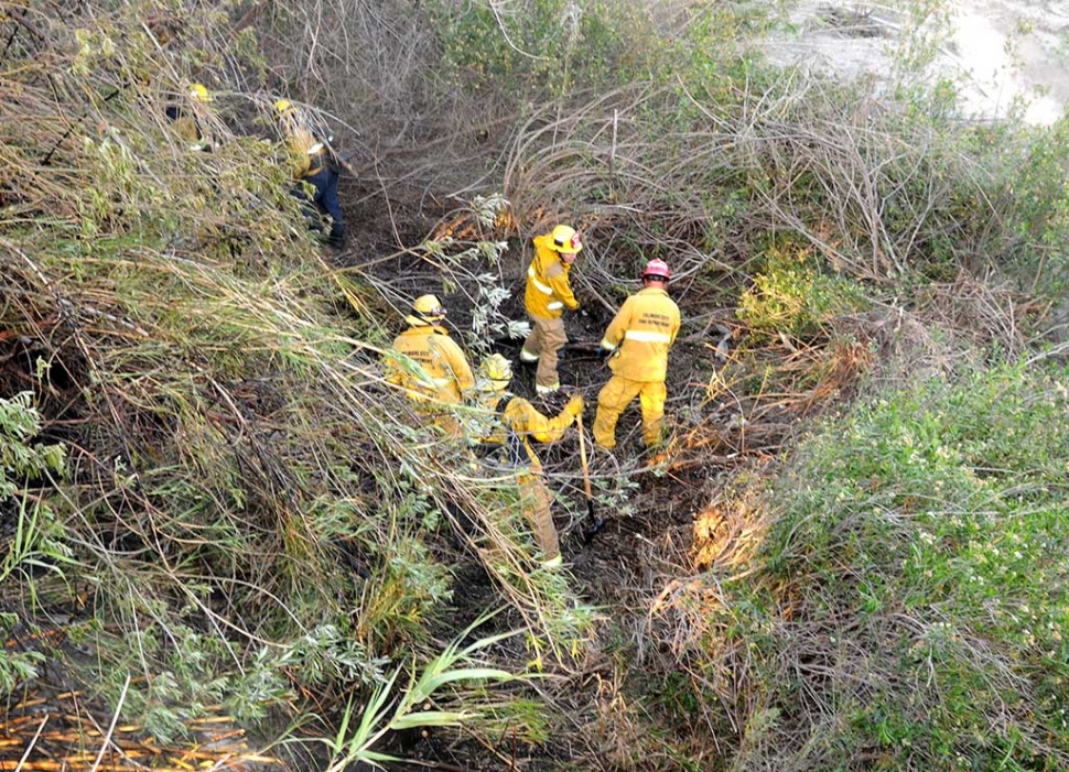 Fillmore City Fire Department firefighters continued to extinguish hot spots after the fire was brought under control.