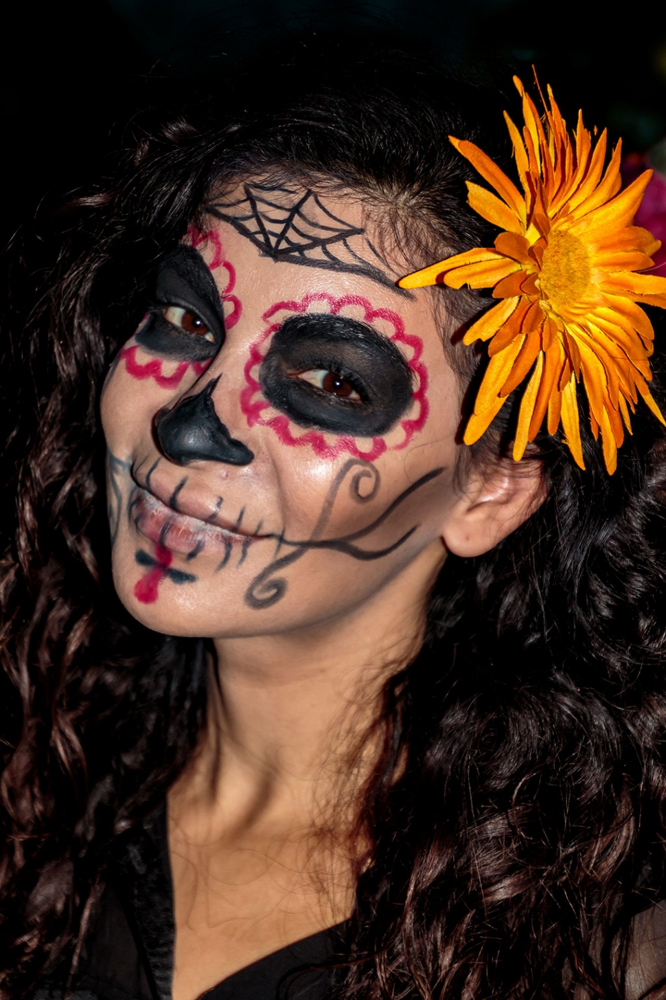 Photo of the Week "The lady, her face artfully painted, recently celebrated Dia De Los Muertos in Fillmore" By Bob Crum. Photo details: Canon 7D MKII camera in manual mode, ISO 400, Tamron 16-300mm lens @63mm, aperture f/5.0, shutter speed 1/60 seconds.
