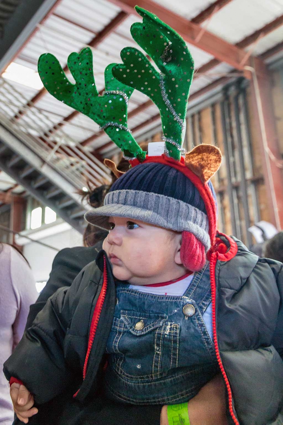 Photo of the Week "Best dressed guy at the fire department toy giveaway!" by Bob Crum. Photo data: Manual mode, ISO 2500, Canon EF-S 15-85mm lens @19mm, f/4.0 & 1/125 second shutter speed.