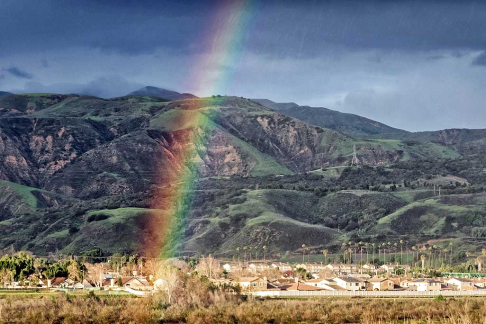 Photo of the Week, by Bob Crum; One end of a rainbow lands in Fillmore right in the middle of a home owner's back yard. I chased it but by the time I got there... it disappeared... along with the pot of gold. Were it not for bad luck, I'd have no luck at all. Nevertheless, ain't rainbows wonderful? Did you notice the steaks in the photo upper right? Rain! Particulars: manual mode, 16-300mm lens at 73mm, aperture f/14, 1/60 of a sec shutter speed, ISO 800.