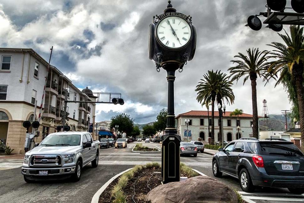 Photo of the Week: "Rush Hour Traffic" by Bob Crum. Central Avenue rush hour traffic on a late Friday afternoon. I shot a similar photo a week earlier. However, the cloudless sky lacked drama creating a boring image. Light is a key element. A cloudless, blue sky exhibits a light of a particular color characteristic. That light didn’t suit a feeling that I wanted to impart in the image I envisioned. In this image, the cloudy sky not only helps me create an overall ‘mood’, it also adds a dimension. The particulars: lens set at 16mm, manual mode, f/11, 1/200 sec, ISO 1250. F/11 for depth of field, 1/200 sec because I was shooting hand held. ISO was set to ‘automatic’ to allow it to float for proper exposure given that the shutter speed and aperture were fixed values. Exposure compensation adjusted in post processing. Comments or questions? bob@fillmoregazette.com