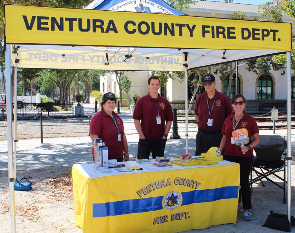 Ventura County Fire Station reps, smiling as they hand out Emergency Preparedness material. Photos courtesy Angel Esquivel—AE News.