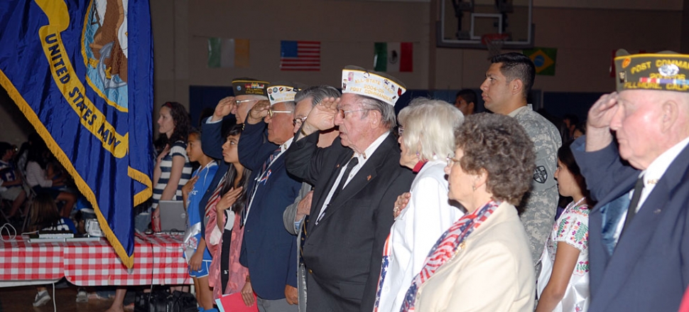 Veterans of Foreign Wars saluted the American flag during the Pledge of Allegiance at Friday’s Pride in America program.