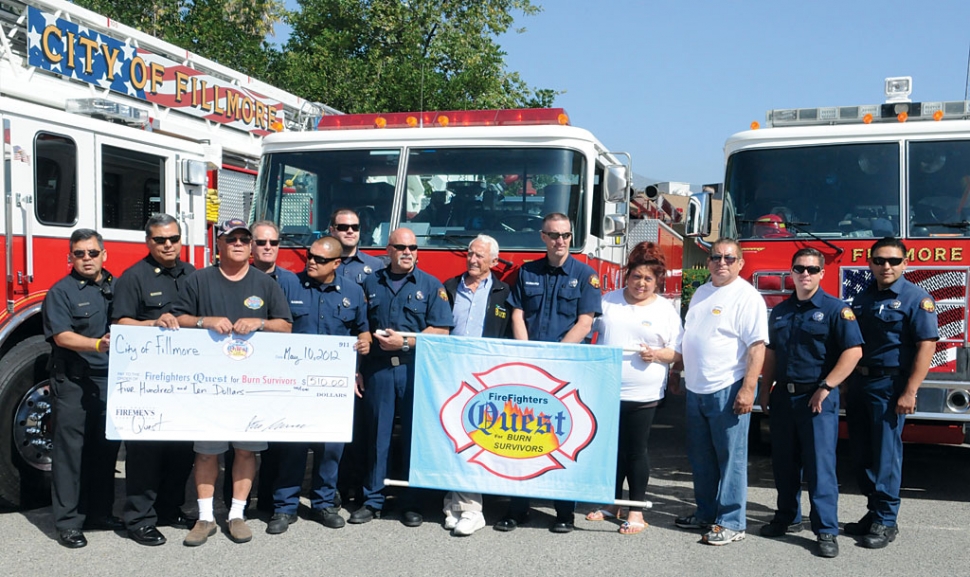 On Thursday, May 10, Fire Fighters Quest for Burn Survivors visited the Fillmore Fire Department. They were flown in by helicopter to Shiells Park, and then escorted to the fire station, where they were presented with a check for $510 from the Fillmore Fire Department. Pictured above are Fire Captain Bill Herrera, Fire Chief Rigo Landeros, Fire Captain Bob Thompson, Fire Captain Billie Gabriel, Engineer Lou Farah, Engineer Rob Rolfe, Founder Dr. Grossman, Firefighter Mark Hubbard, and Firefighter Robert Katz, Firefighter Joe Palacio, and several Quest burn associates.