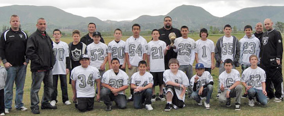 Pictured above but not in order : Bryce Farrar #1, Tyler Bode #4, Johnny Grove #6, Anthony Morales #20, John John Gonzales #21, Marco Villa #23, Moy Pedroza #25, Ray Luna #26, Matthew Wilmot #27, Chris Torres #30, Anthony Cardoza #32, Jared Alvary #34, Eric Corona #35, Damian Alvarez #38, Junior Sandoval #52, Christopher Espinosa #54, Vincent Whittaker #62, Marcus Gonzales #64, Cody Isaacs #70, Justin Long #75, and David Vargas #97. Head Coach John Ortiz, Asst. Coach Nathan Page, Coaches Eddie Ortiz, Mike Rivera, Vince Corona, John Grove, Tony Cortez, Rick Myers, Ronnie Ortiz.