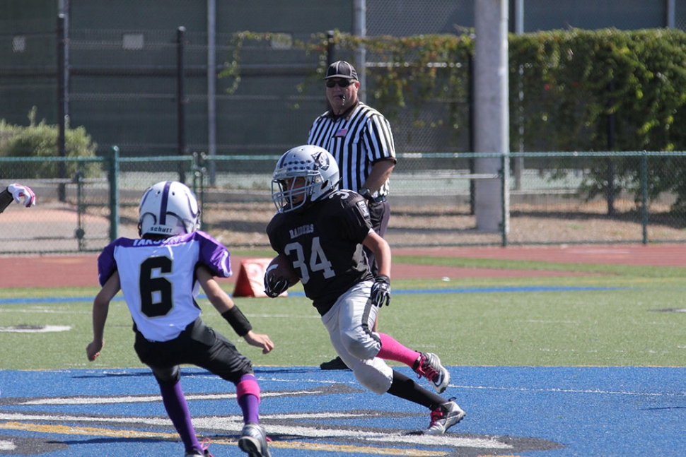 Raiders Junior #34 makes a first down run