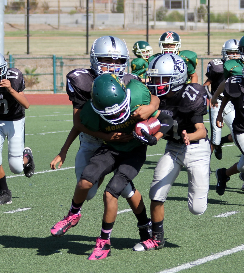 Raiders Junior 1 #2 and #27 make a tackle