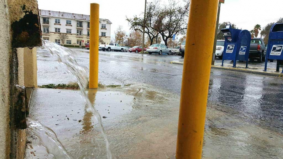 Rain was running down the alley west of Central Avenue Tuesday morning. The first of at least three storm fronts hit Fillmore in the early morning hours of Tuesday, January 4th Rain is expected to continue, on and off, through Friday, with a new storm coming next Wednesday, January 13th. Photo courtesy Sebastian Ramirez.