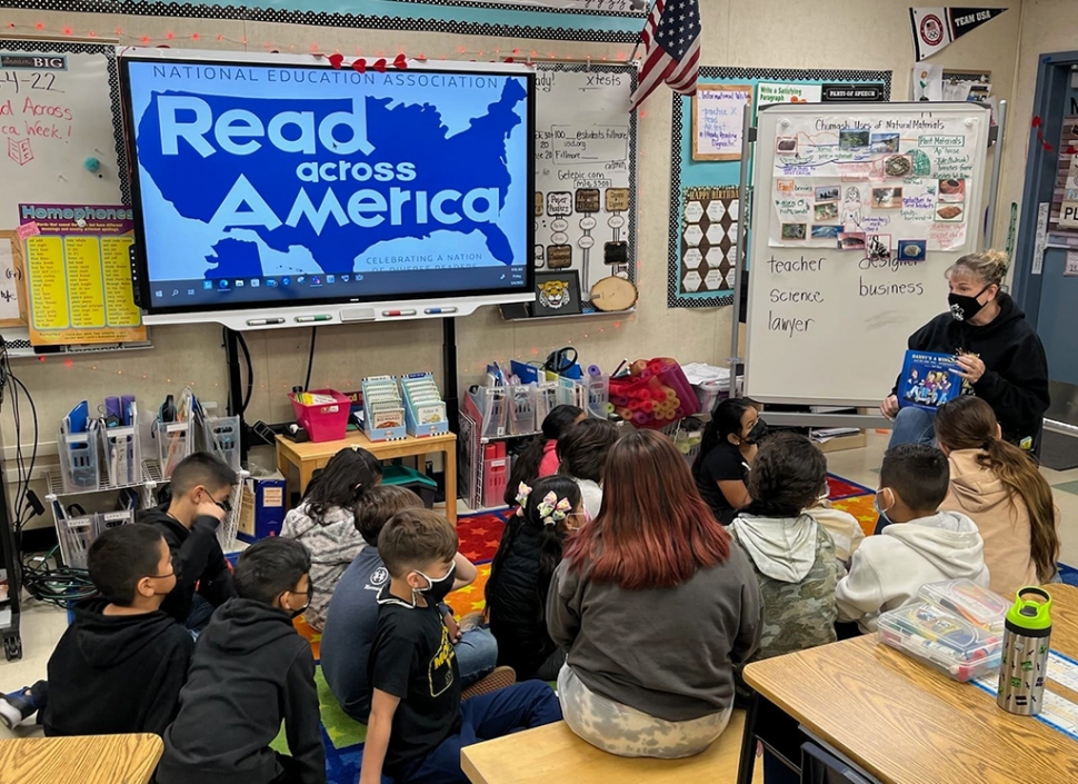 Mountain Vista Elementary had a special guest visitor read to them in celebration of National Read Across America Day. Above, are students listening to a story from Principal Christine McDaniels. 
