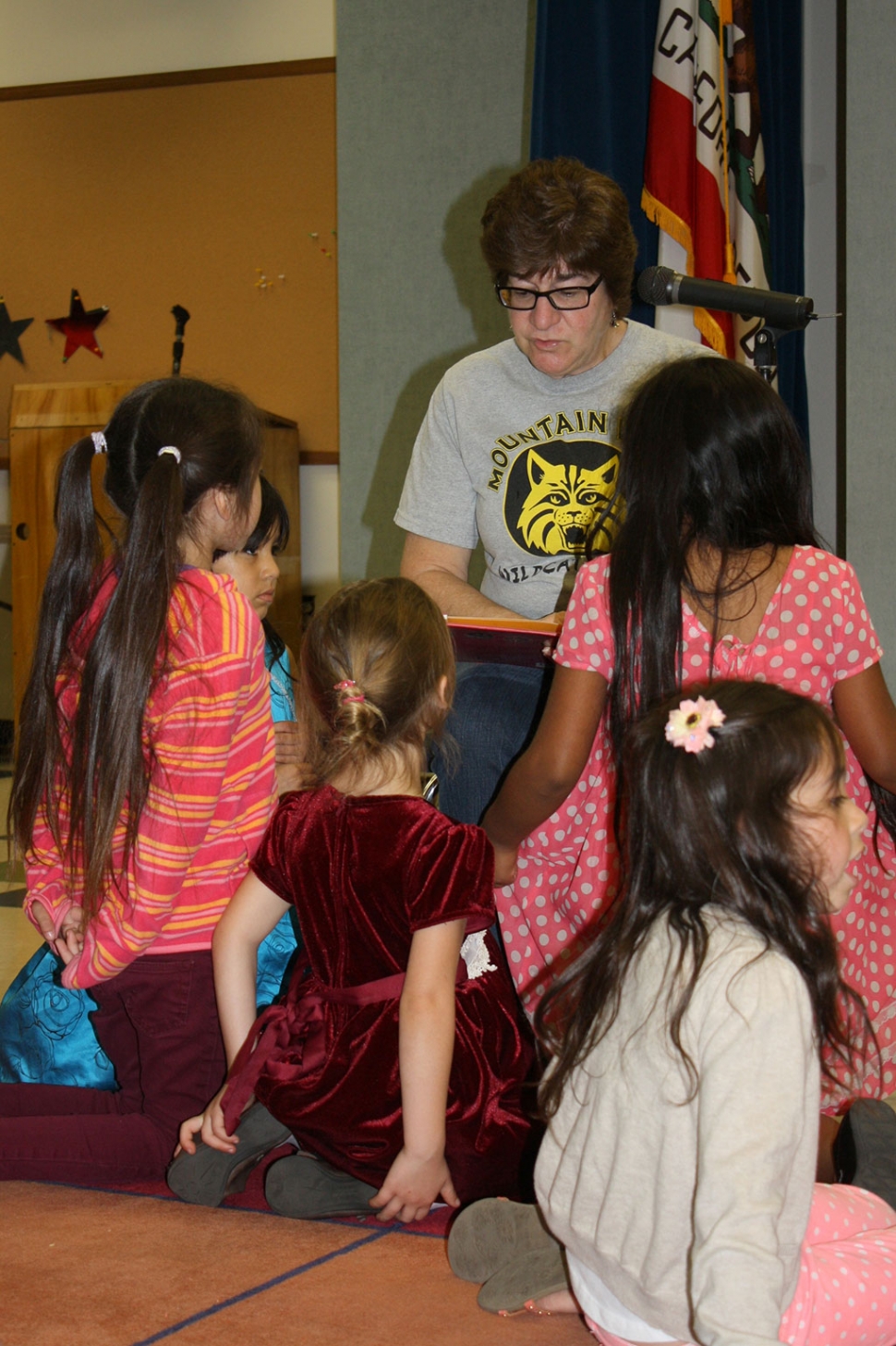 Teacher Sandra Butts reading to students.