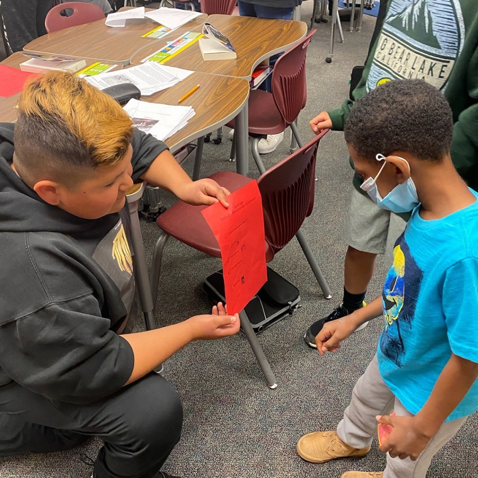 Last week the Rio Vista 5th graders hosted a Gallery Walk to teach their kindergarten Reading Buddies about what they have been learning in class. Pictured are students working and learning together. Courtesy Rio Vista Elementary Blog.