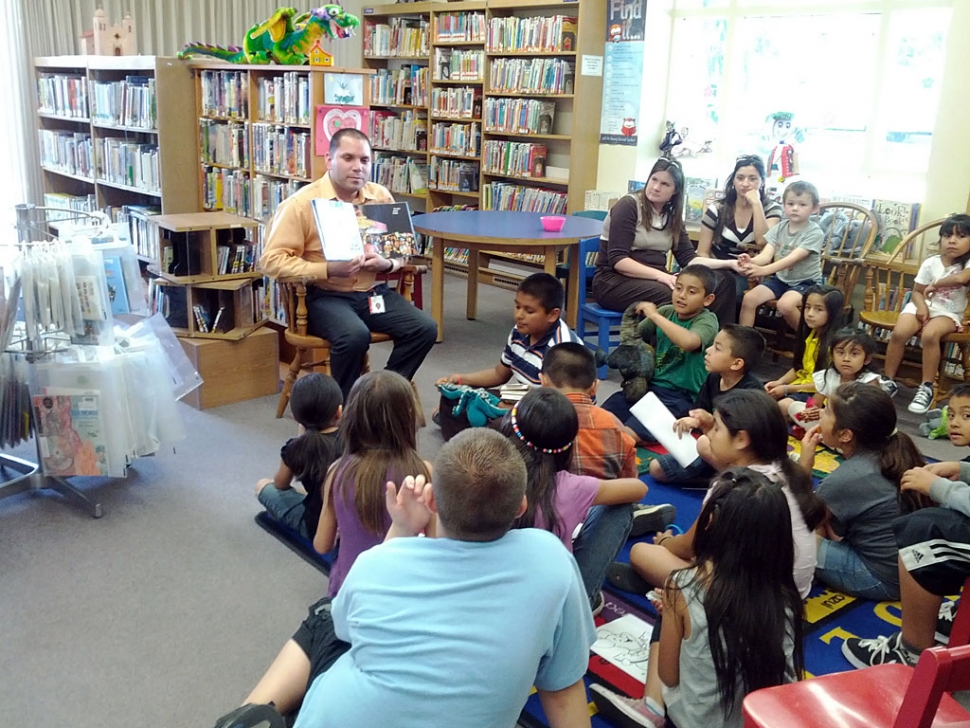 Shawn Diaz, Chairman of the Fillmore May Festival, reading the book