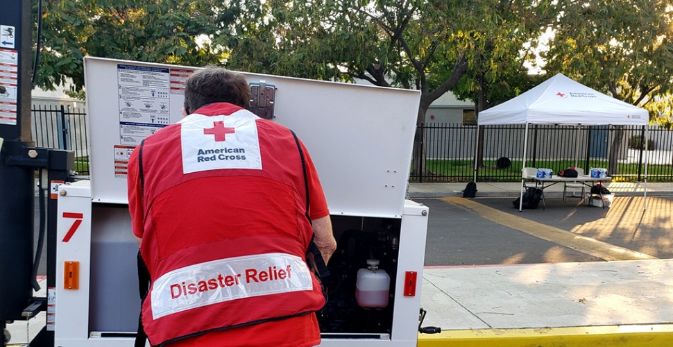 Red Cross volunteer fires up flood lights at the evacuation center at Fillmore Middle School on Monday, August 17, 2020. Photo courtesy American Red Cross.