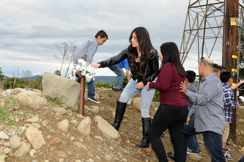 On Sunday, Adrian Moreno’s family planted a cross on the Grand Avenue murder site in
his memory.