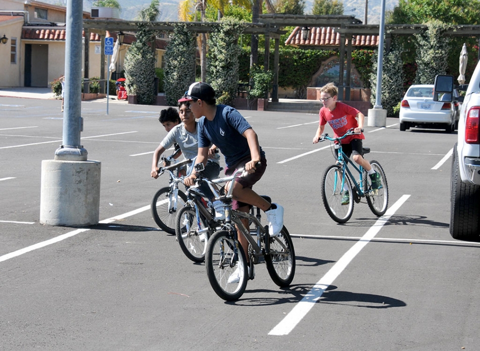 A group of boys are pictured enjoying themselves, racing each other in the St. Francis church parking lot. With at home restrictions slowly being lifted more and more people are enjoying some outdoor fun!