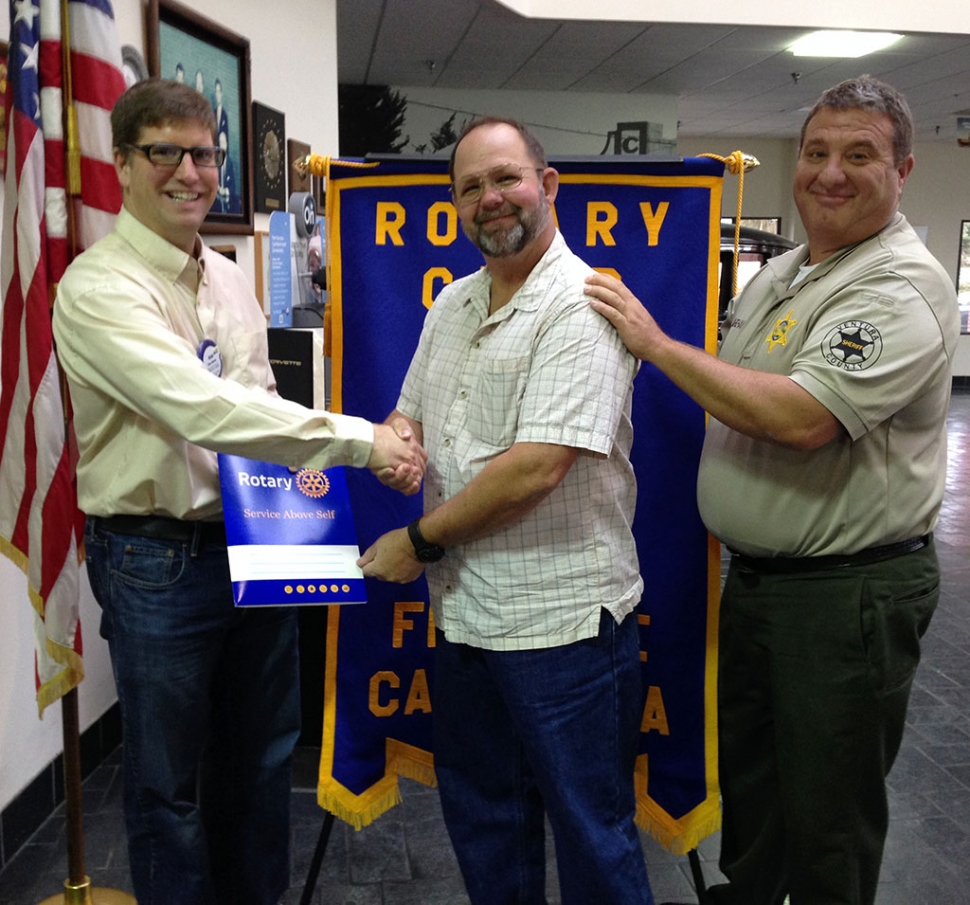 Sean Morris, Rotary President inducted Ed Tumbleson as a new member, Dave Wareham was his sponsor.