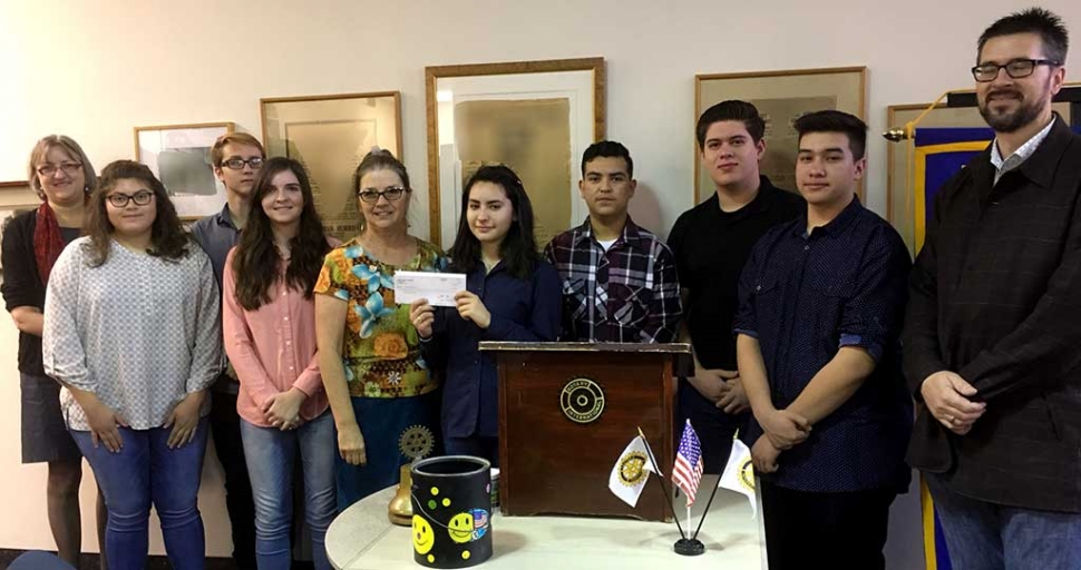 Rotary Club Present Check to the Fillmore High School’s Mock Trial Team. FHS students, Mr. Murphy & Laura Bartels receiving a check supporting the FHS Mock Trial Team from club president Julie Latshaw.