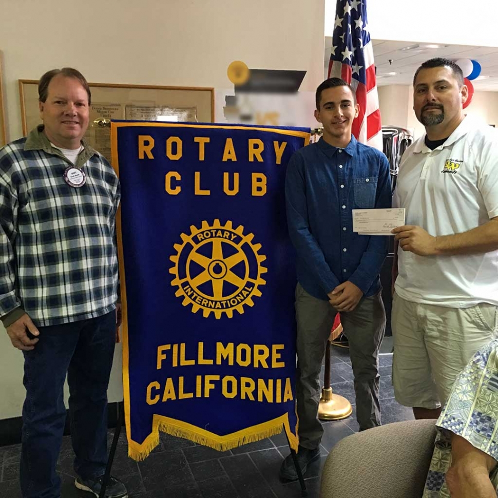 Scott Beylik presented a donation check to Matt Van Breemen, ASB Vice President of Sierra High School, and Louis Lomeli.