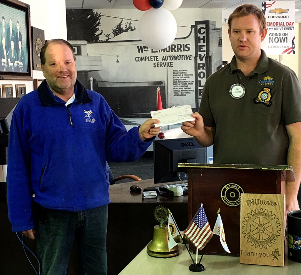 Rotary President Andy Klittich presented a check for $250 to Scott Beylik, of the Fire Foundation, to be used for the Rigo Landeros Memorial Golf Tournament. Photo courtesy Martha Richardson.