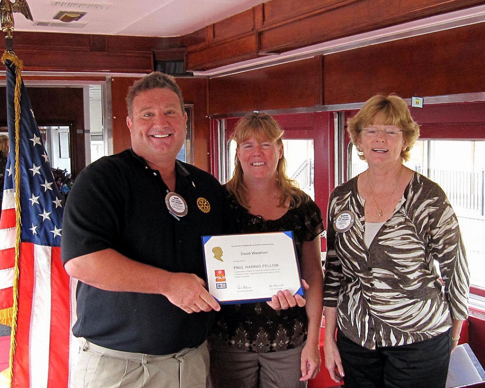 David Wareham receiving the Paul Harris Award, his wife Diane, and Martha Richardson, President.